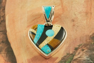 This Heart Pendant is a Work of Art! Featuring Genuine Picture Jasper, Turquoise and Black Jade inlaid in Sterling Silver. Free 18" Sterling Silver Chain with Purchase of Pendant. Designed by Navajo Artist Calvin Begay. Signed by the artist.