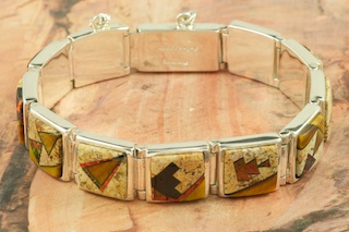 Stunning Bracelet featuring Genuine Picture Jasper and Black Jade inlaid in Sterling Silver. Accented with Beautiful Fire and Ice Lab Opals. Designed by Navajo Artist Calvin Begay. Signed by the artist.