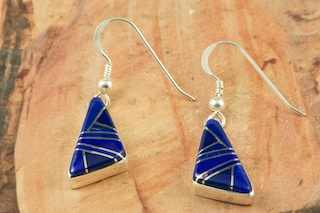 Genuine Blue Lapis inlaid between ribbons of  Sterling Silver. Beautiful Sterling Silver French Wire Earrings Designed by Navajo Artist Calvin Begay. Signed by the artist.