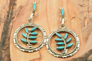 Genuine Sleeping Beauty Turquoise set in Sterling Silver Post Earrings. Beautiful Petit Point Design. The Sleeping Beauty Turquoise mine is located in Gila County, Arizona. Created by Zuni Artist Floyd Estate. The Zuni Pueblo is located in New Mexico, Land of Enchantment.