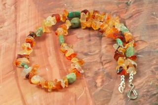 Genuine Turquoise and Carnelian Necklace. Sterling Silver Beads and Clasp. Created by Santo Domingo Artist Carol Pacheco. The Santo Domingo Pueblo is in New Mexico, near Santa Fe.
