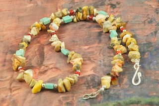 Beautiful Necklace features Genuine Picture Jasper, Turquoise and Red Jasper. Accented with Sterling Silver Beads. Sterling Silver Clasp.  Created by Santo Domingo Artist Carol Pacheco. The Santo Domingo Pueblo is in New Mexico, near Santa Fe. 