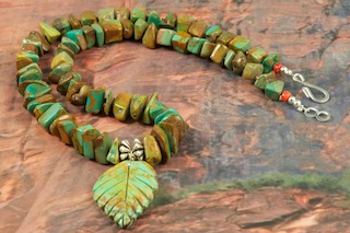 Beautiful Necklace featuring Genuine Kingman Turquoise with Hand Carved Leaf. Accented with Sterling Silver Fluted Beads and Clasp.  Created by Santo Domingo Artist Carol Pacheco. The Santo Domingo Pueblo is in New Mexico, near Santa Fe.
