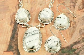 Genuine White Buffalo Turquoise set in Sterling Silver. Stunning Necklace and Earrings Set. Created by Navajo Artist Lucy Valencia. Signed L. J. by the artist. The photo is of the jewelry you will be receiving. This Beautiful Stone is formed from the minerals Calcite and Iron. It is mined near Tonopah Nevada.