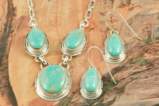 Genuine Number 8 Mine Turquoise Stones set in Sterling Silver. Beautiful Necklace and Earrings Set. Created by Navajo Artist Lucy Valencia. Signed by the artist. The photo is of the jewelry you will be receiving. The Number 8 mine is located in Eureka County Nevada. Since 1976 there has been no Number 8 Turquoise mined. There is however, an existing stock pile that Mr. Dowell Ward, the last owner of the Number 8 mine, had stocked away for later sorting. The Turquoise is a collector's item--because once the reserve is gone there will be no more material released onto the market. The Gold Mining Company owns the claim to the Number 8 mine and it has been swallowed up by the gold mining operations. This is some of the last Number 8 Turquoise to be had and will be a great addition to your collection.