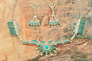 Stunning Necklace and Post Earrings featuring Genuine Sleeping Beauty Turquoise set in Sterling Silver. Beautiful Needle Point Design. Created by Zuni Artist Rena Cachini. Signed by the artist. The Zuni Pueblo is located in New Mexico, Land of Enchantment.